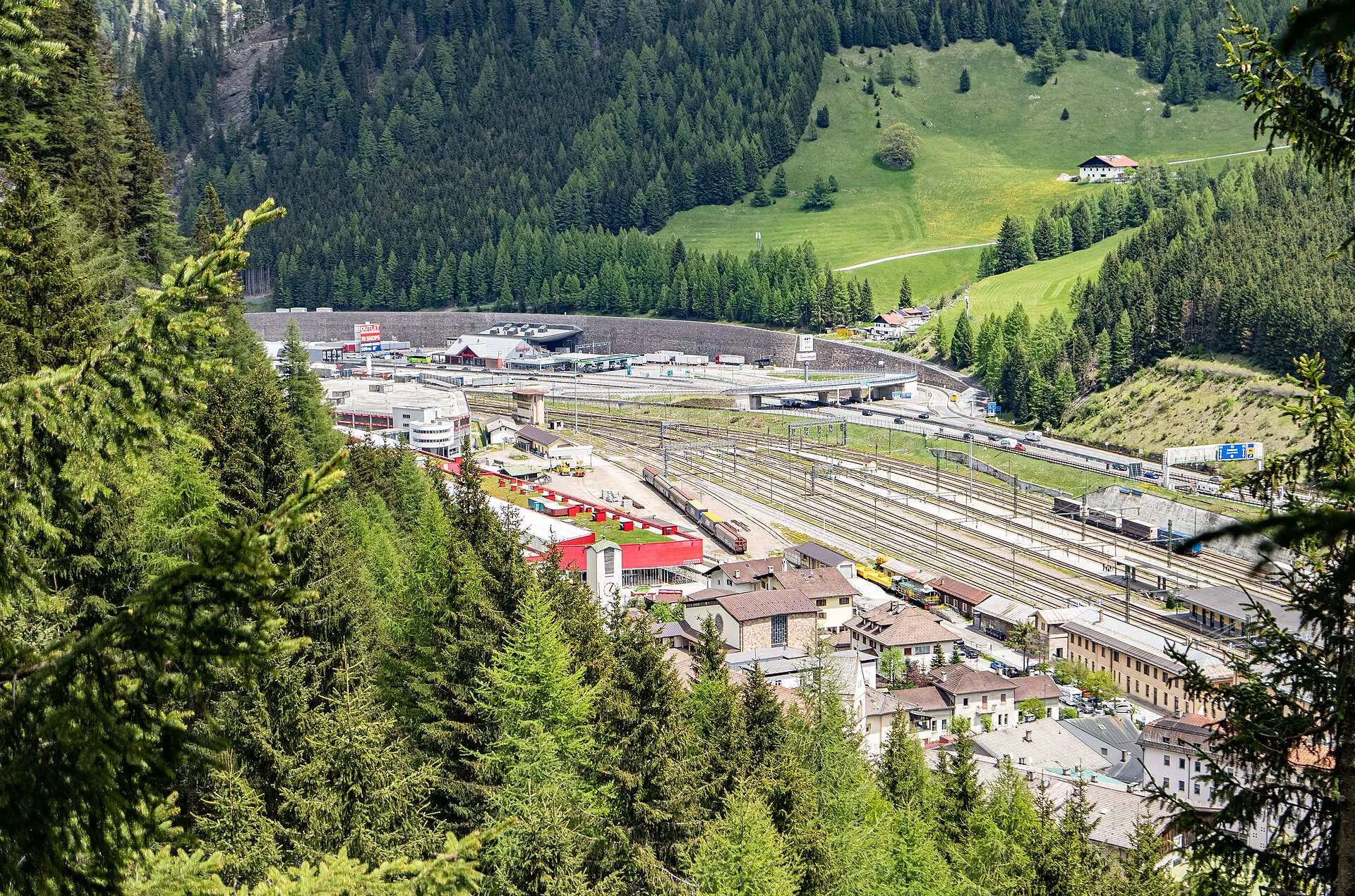 An aerial view of the Brenner Pass with the border station, the railway yard and the motorway.