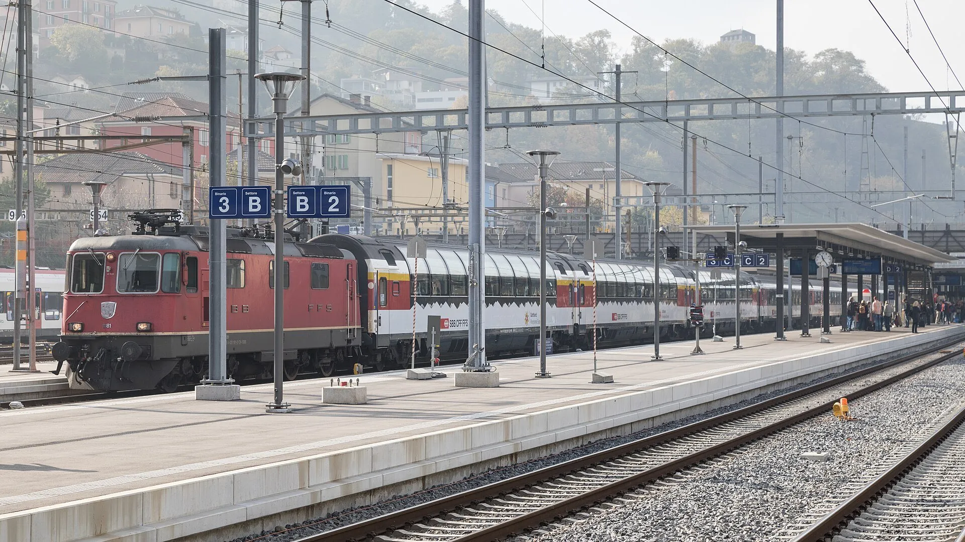 The Gotthard Panorama Express with its panoramic coaches standing at a platform in Bellinzona.